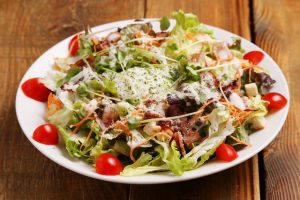 Caesar salad with bacon and croutons